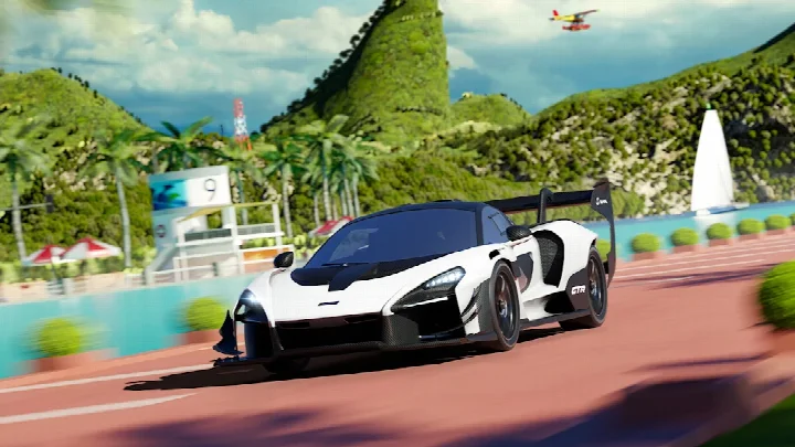 Screenshot of a gameplay moment with a car performing a 360° jump and stunt.